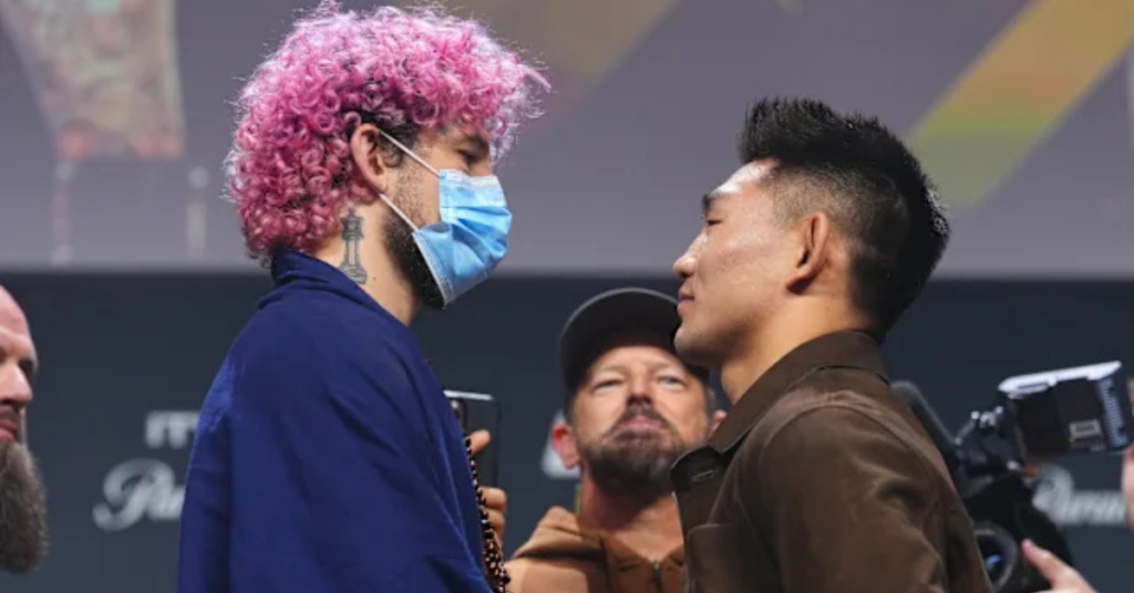 China's Song Yadong Reacts to Sean O'Malley's COVID Mask During Faceoff