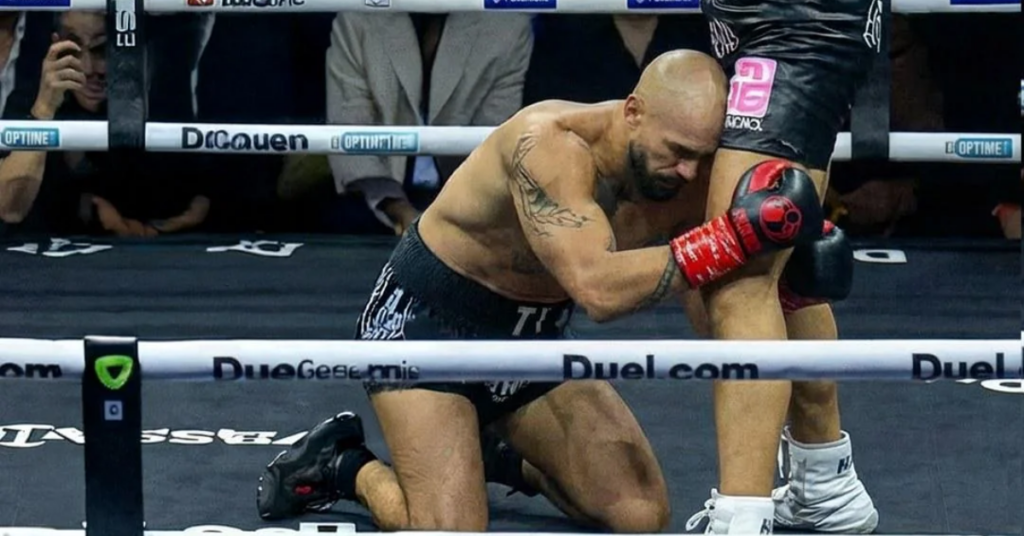 andrew tate on knees